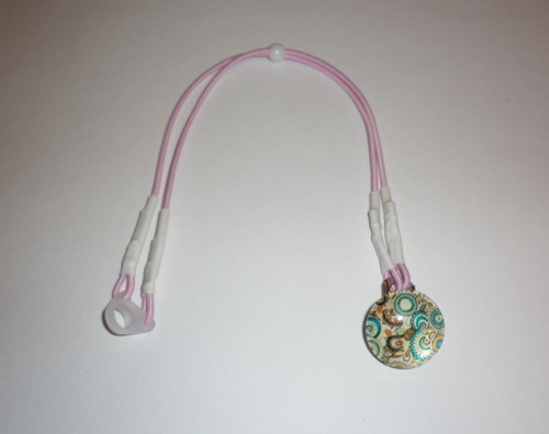 Záchytný klip na 2 sluchadla béžový ornament